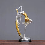 statue moderne femme mouvement argenté doré bleu lisse brillante base noire abstraite