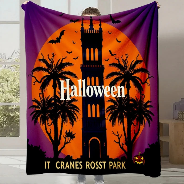 Une scène d'Halloween animée avec un paysage tropical, des silhouettes de palmiers et un château sombre sur un fond orange et violet.