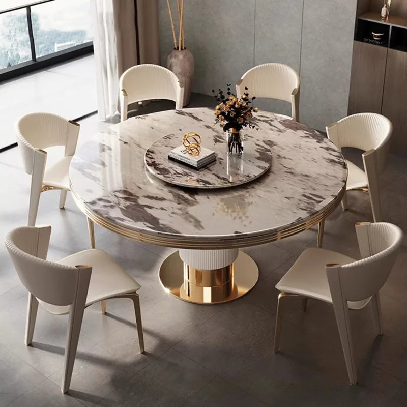 table ronde marbre moderne blanc gris pivotante chaise dorée minimaliste assise vase assiettes salière