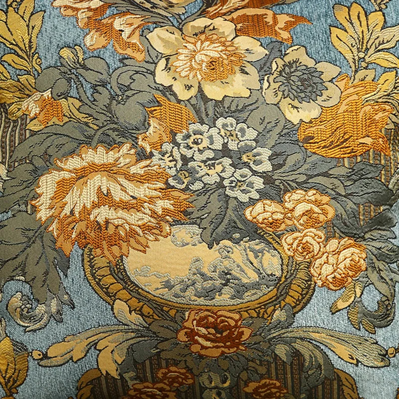 Un bouquet de fleurs stylisées, dans des tons chauds d'orange et de jaune, agrémenté de feuillages et de motifs géométriques sur un fond bleu grisé.
