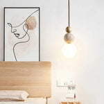 lampe suspendue pierre moderne ampoule g9 blanc beige marron foncé texture granulée lumière opaques