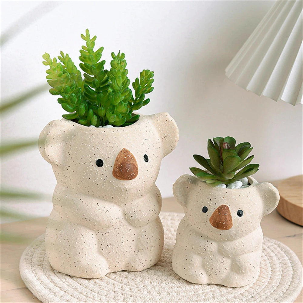 cache pot animalier céramique blanc taches brunes texture gréseuse moderne décoration intérieure plante verte