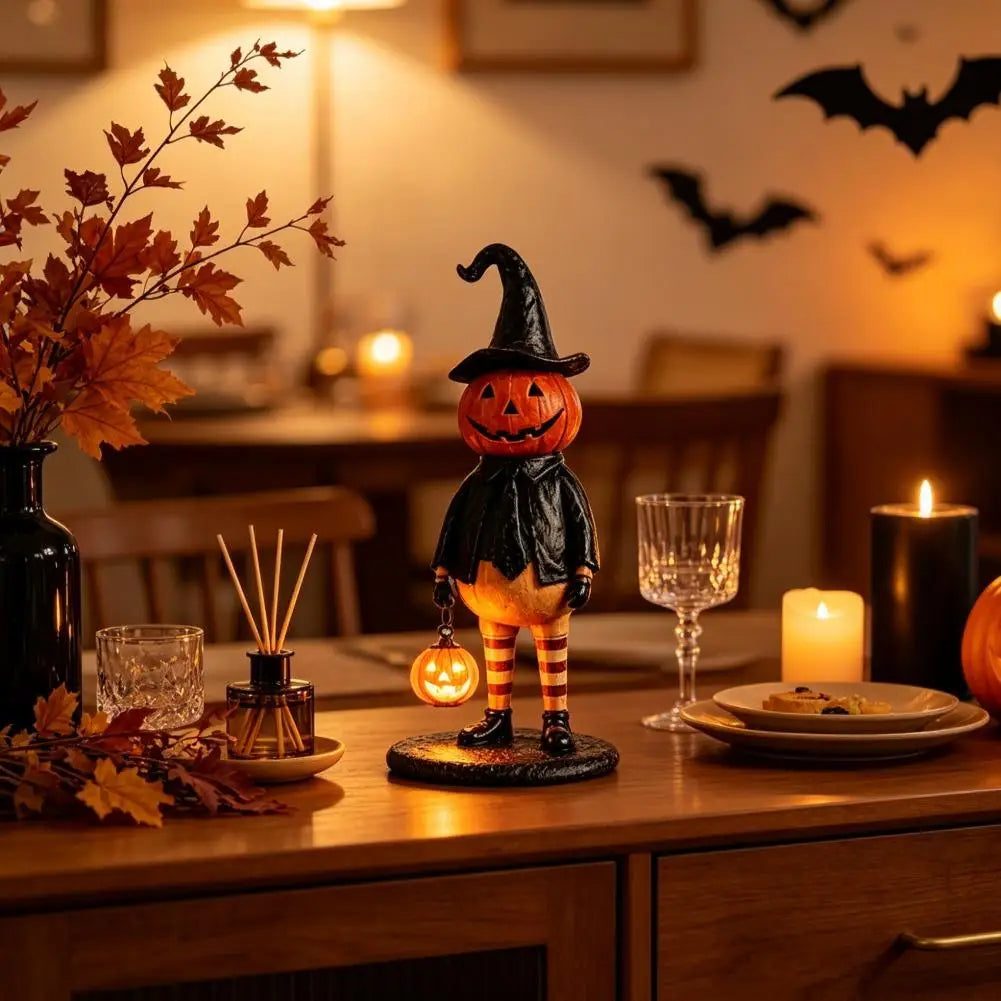 figurine citrouille halloween orange chapeau robe noire bas sculptée décoration intérieure festive