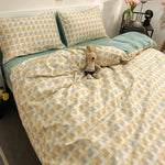 Ensemble literie coton avec taies d'oreiller sur un lit queen size