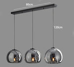 suspension pendentif noir transparent moderne têtes ambrées têtes noires flux lumineux 249 2000 autonome