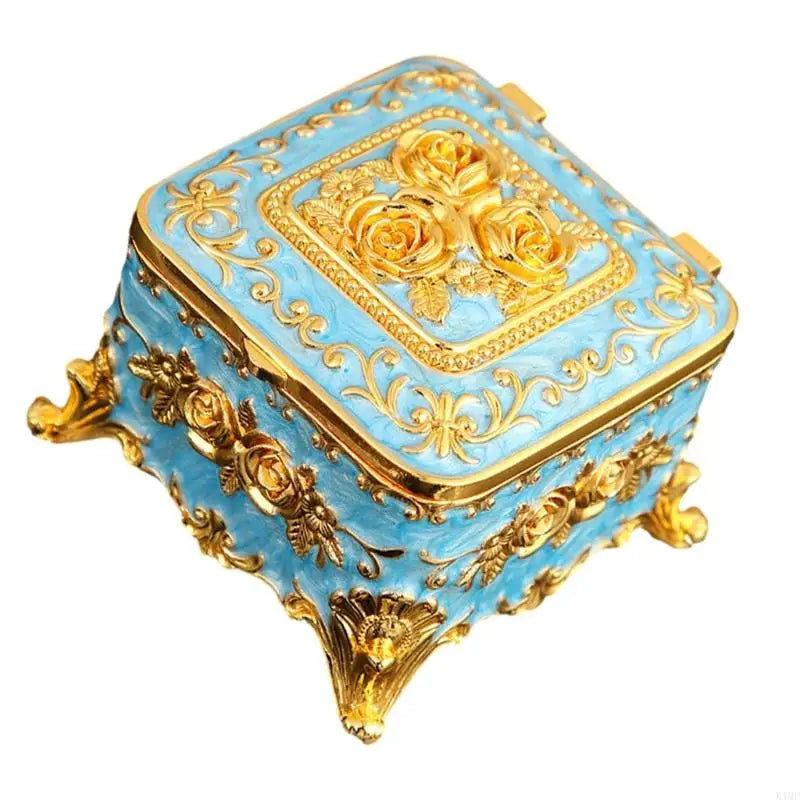 Boîte à bijoux métal vintage ouverte montrant les compartiments intérieurs