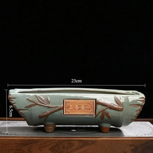 pots plantes céramique verte motifs floraux bambou décoratives gravures chinoises pierres