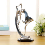 statue moderne femme mouvement argenté doré bleu lisse brillante base noire abstraite