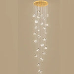 suspension lumineuse moderne transparente dorée facettes géométriques élégantes multiples lampes