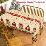 nappe table noël cloches dorées fleurs rouges feuilles vertes guirlandes flocons dorés classique