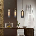 suspension lumineuse moderne gris fumé doré verre mat métal poli ampoule filament visible chambre