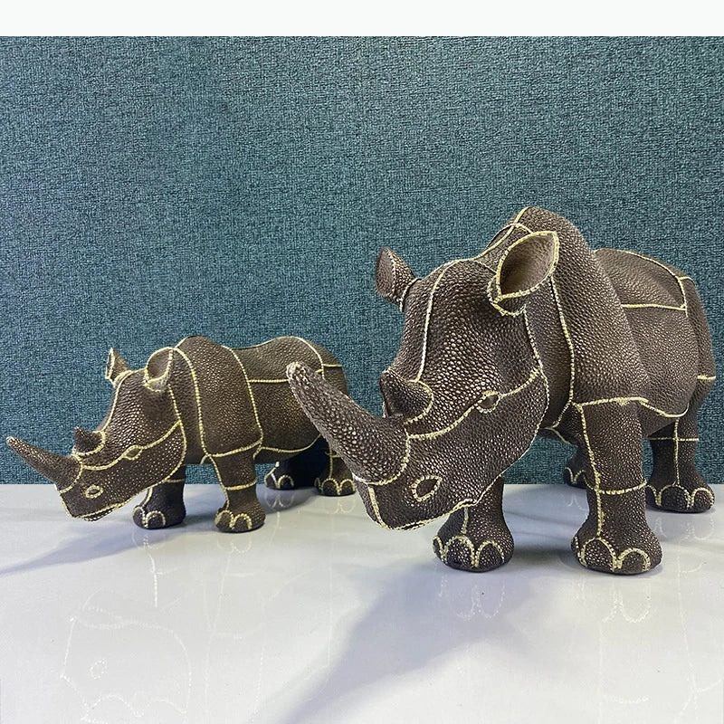 statuette rhinocéros marron foncé texture granuleuse décoratif animalier doré grande petite