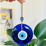 pendentif œil malheur bleu foncé oeil blanc cordelette traditionnel protection maison
