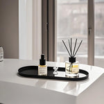plateau ovale moderne noir mat bijoux parfum flacon lotion bougie calendrier decoration