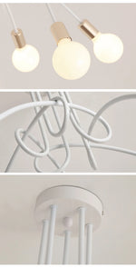 suspension lumineuse moderne noir doré ampoules blanches structure spirale fixation câbles métallique