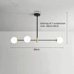 suspension lumineuse moderne minimaliste noir doré blanc sphères translucides métal poli