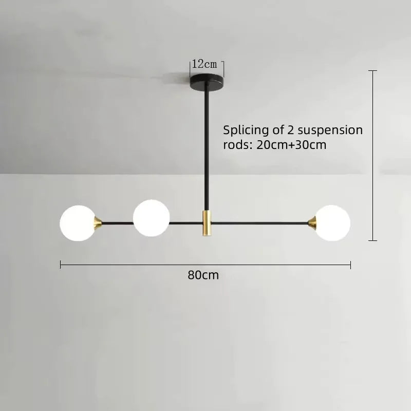 suspension lumineuse moderne minimaliste noir doré blanc sphères translucides métal poli