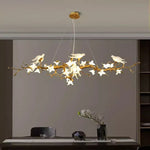 Suspension lumineuse moderne oiseaux transparents branches dorées fleurs blanches led verre chrome poli chambre