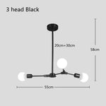 suspension lumineuse moderne or noir sphères translucides scandinave structure métallique pince suspension