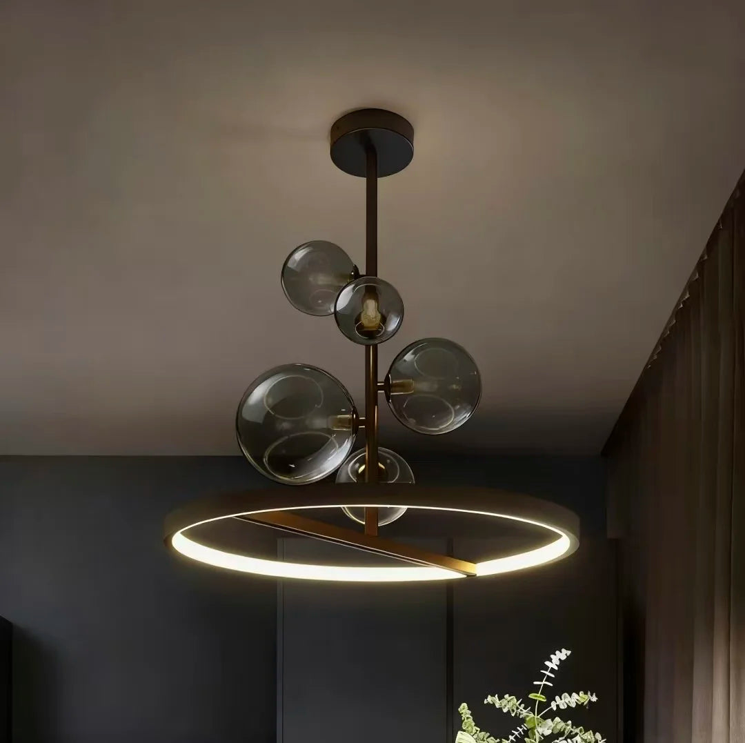 suspension lumineuse moderne sphères verre transparent anneaux métalliques noir doré grisclair
