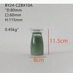 ensemble vaisselle céramique vert clair tasses bol carafe couvercle plateau fruits bougie fleur artificielle