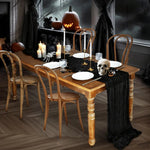 ruban table noir crêpe halloween décorations citrouilles crânes fourchettes assiettes bougies