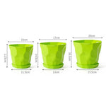 Pots plantes vertes durables multifacettes couleurs blanc orange bleu moderne