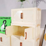 armoire pliante tiroirs beige moderne rayures diagonales poignées dorées roulettes sans