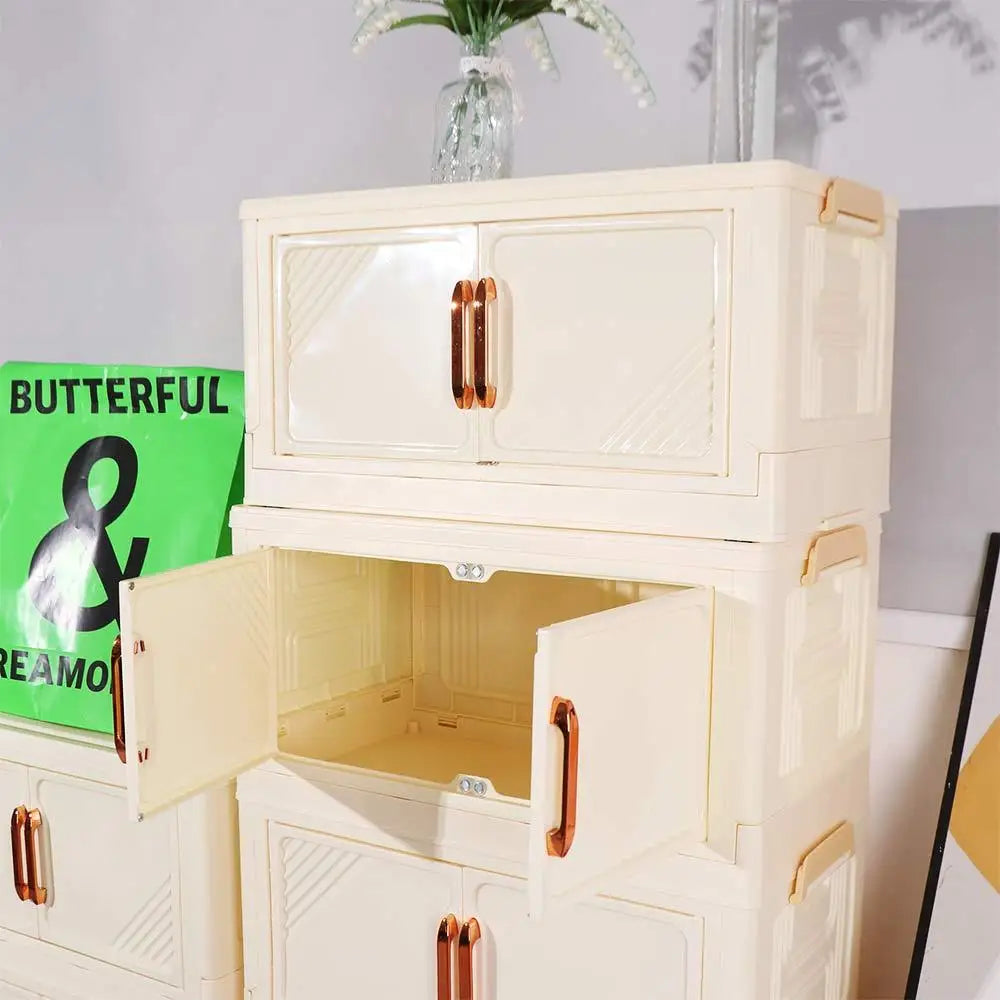 armoire pliante tiroirs beige moderne rayures diagonales poignées dorées roulettes sans