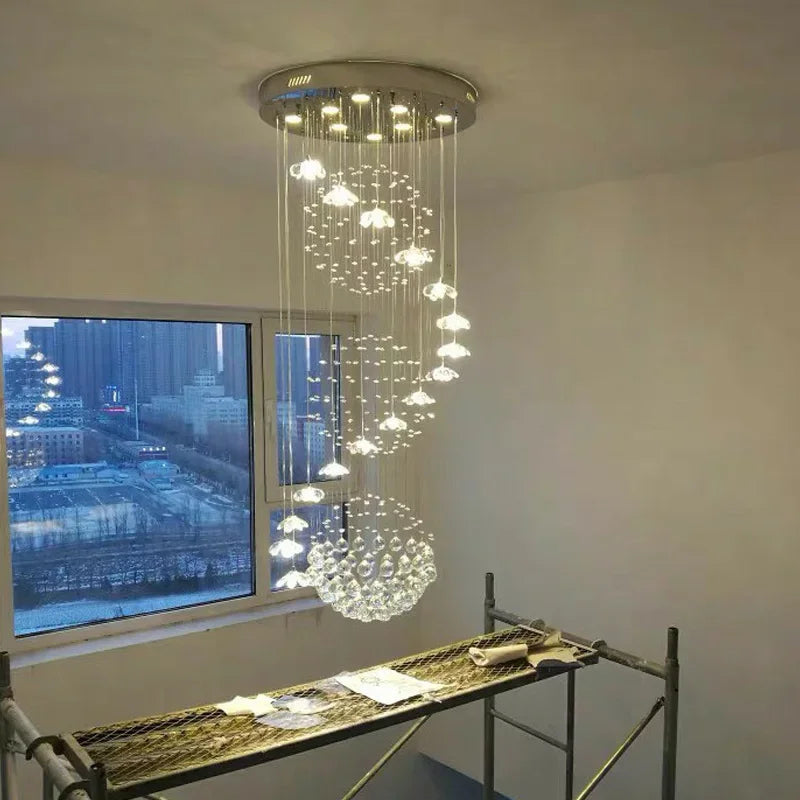Suspension lumineuse moderne cristal transparente salon chambre étude 2000 82000 flux lumineux