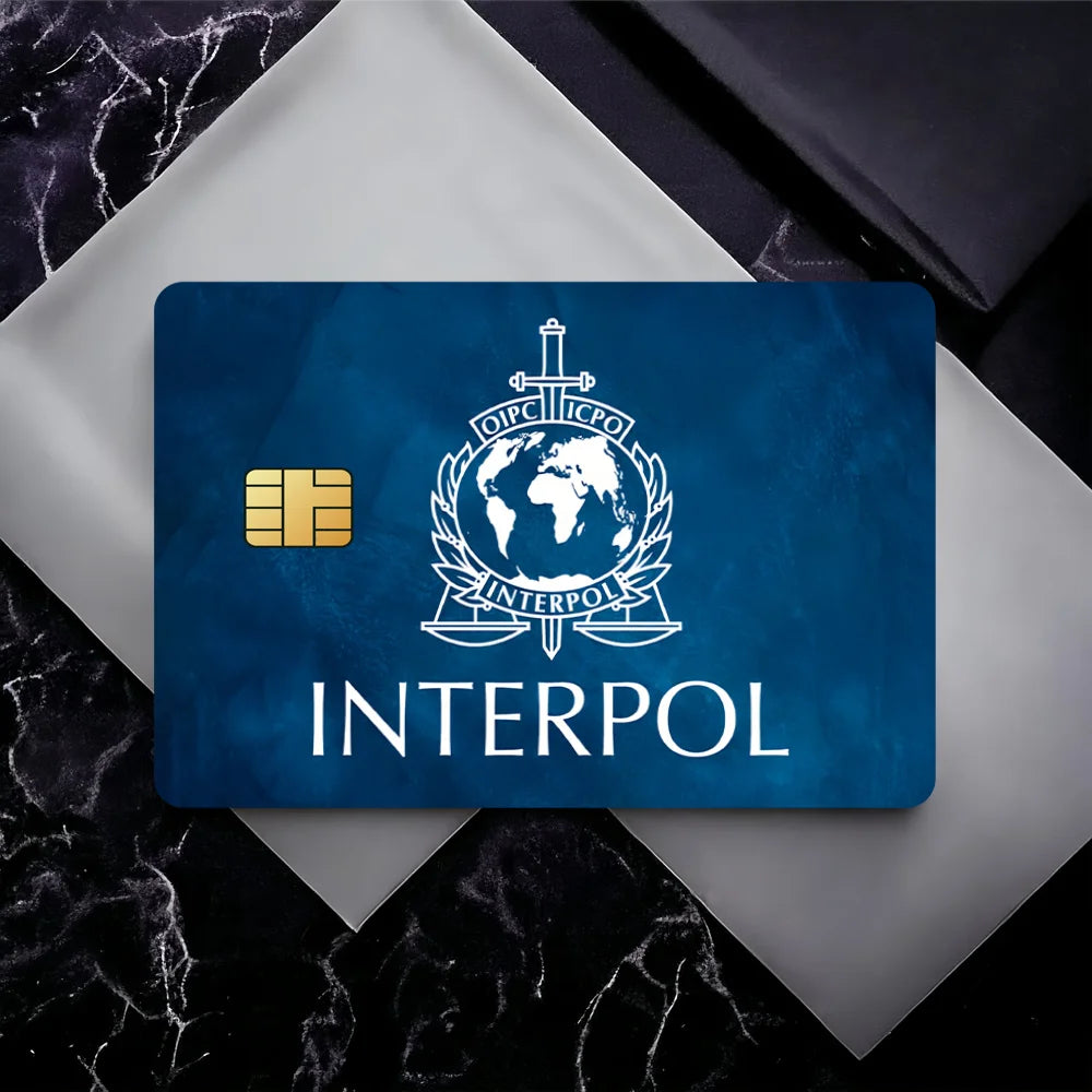 stylo bille bleu interpol logo globe épée carte bancaire