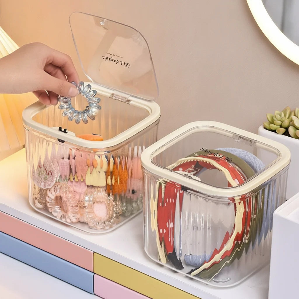 boîtes rangement accessoires cheveux transparentes poignées blanches rayures verticales moderne minimaliste femmes domestique