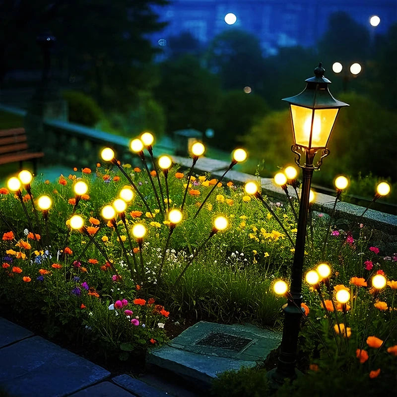 éclairage paysager solaire led moderne boules lumineuses colorées branches métalliques fixation tige terreextérieur nocturne