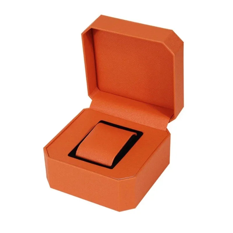 montre vintage cuir noir fond orange boite rangement elegante exposition