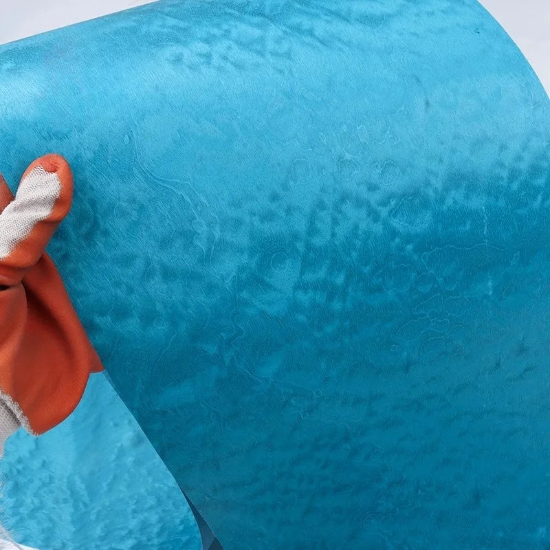 rouleau bois texturé bleu turquoise décoratif artisanal souple craquelé main gantée orange manipulation facile