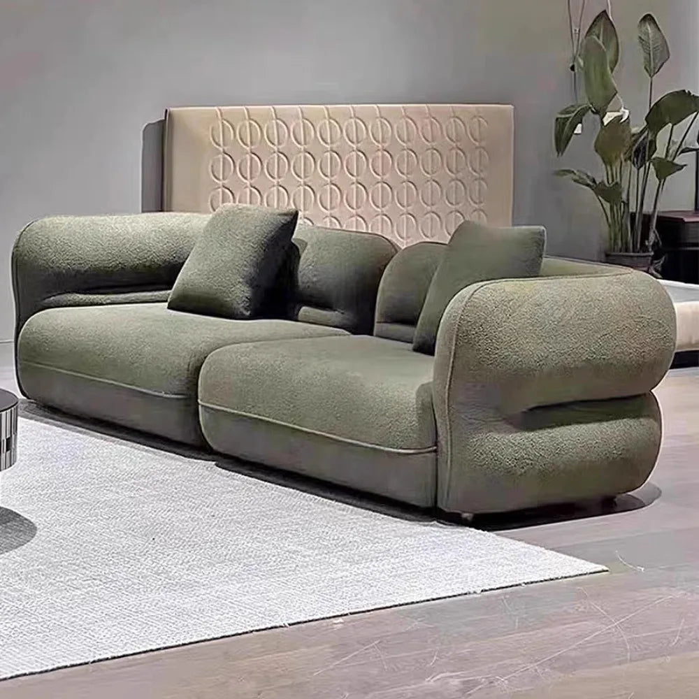 canapé moderne vert olive beige clair tissu bouclé confortable pieds ronds coussins décoratifs forme