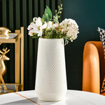 Cache-pot orange avec plante verte