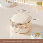 boîte bijoux transparente moderne blanc violet rose compartiments miroir rangement voyage