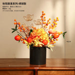 décoration intérieure moderne fleurs artificielles vase noir roses arrondies éléments dorés asiatique