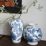 vases bleu blanc fleurs oiseaux feuillage classique decoration table arrangement fleurs moderne