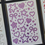 feuilles autocollantes motifs cœurs étoiles rubans abstrait rose jaune bleu violet rouge enfants