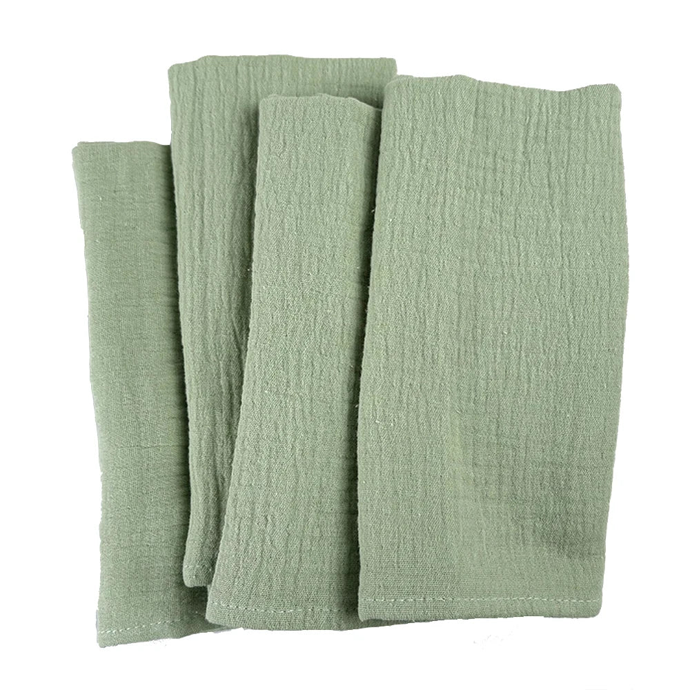 Pile de serviettes en coton de couleur vert sauge.