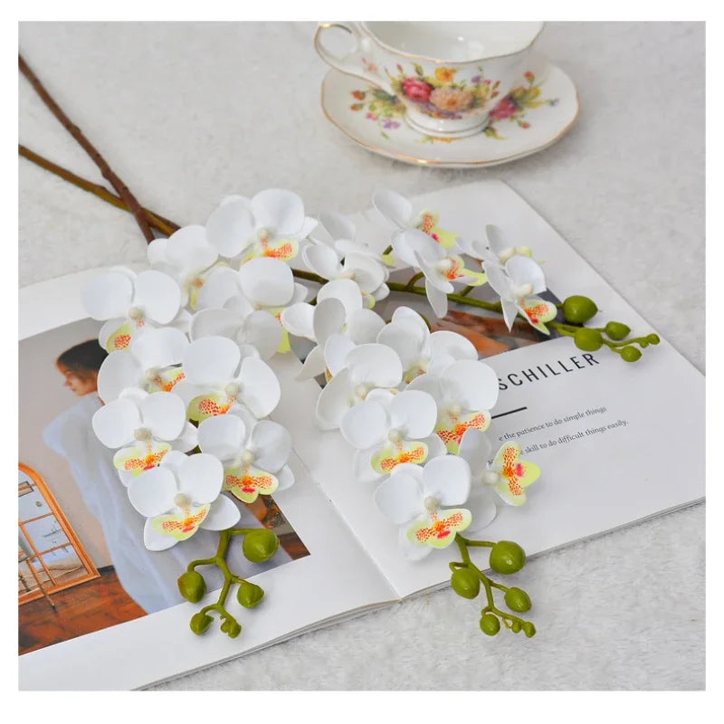 décoration intérieure bouquet orchidée papillon soie blanc rose orange jaune moderne minimaliste