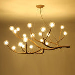 suspension lumineuse moderne branches naturelles sphères translucides marron clair blanc