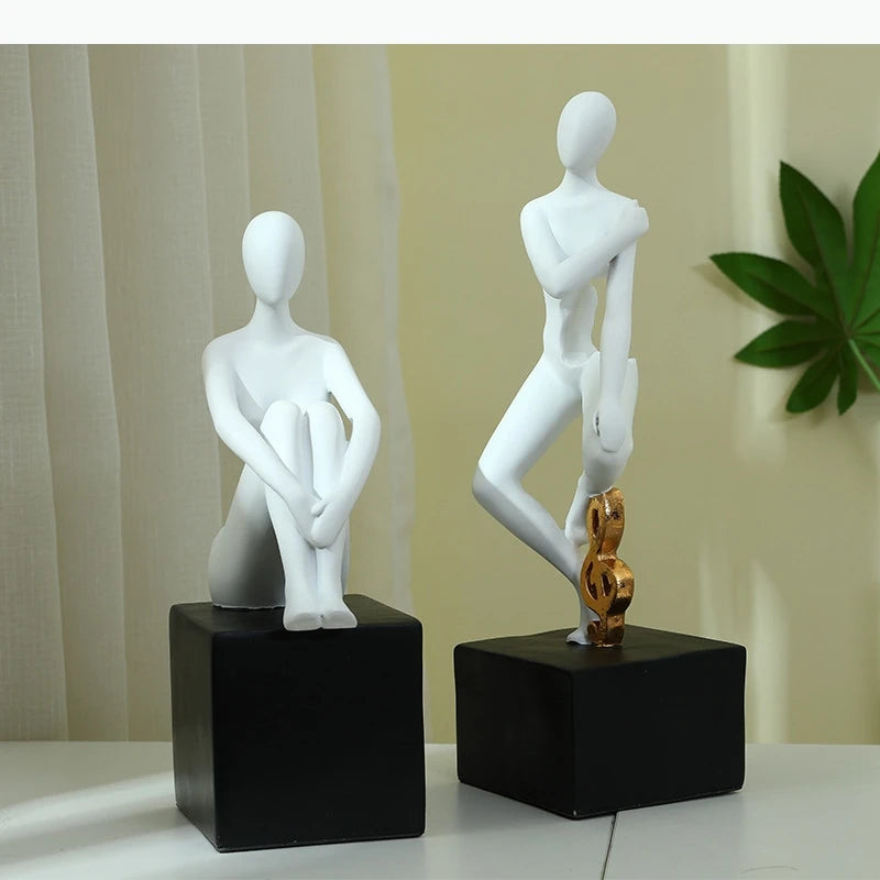 statues décoratives minimalistes figures humaines stylisées blanc noir élément doré moderne abstrait