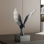 sculpture oiseau moderne minimaliste noir argenté plumes stylisées transparent salon