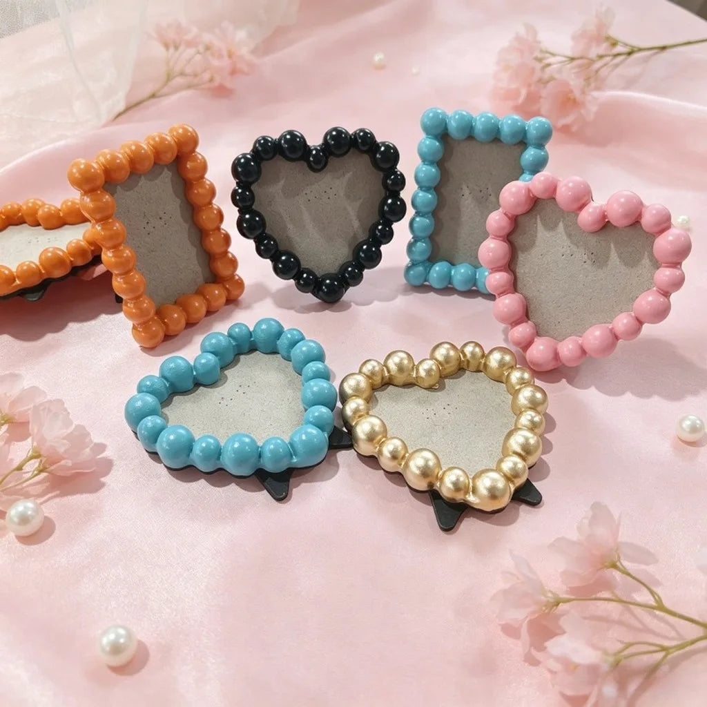 cadre photo moderne rondes orange noir bleu clair rose doré blanc clips noirs fond