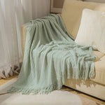 couverture tricotée vert foncé motif zigzag pompons canapé lit décoration intérieure moderne large
