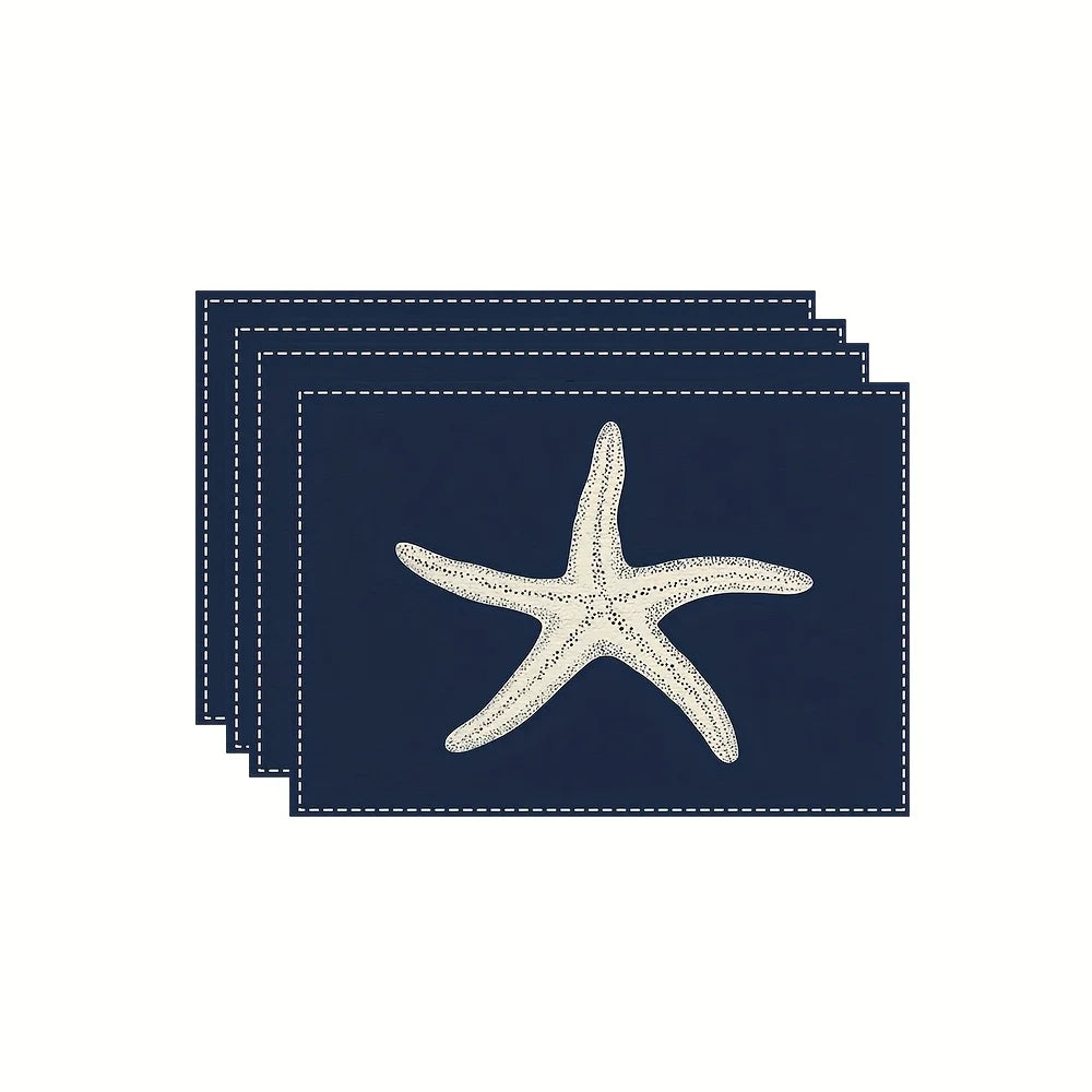 serviettes table bleu marine étoiles mer moderne fourchettes cuillers tasses soucoupes vase fleurs assiettesscrição
