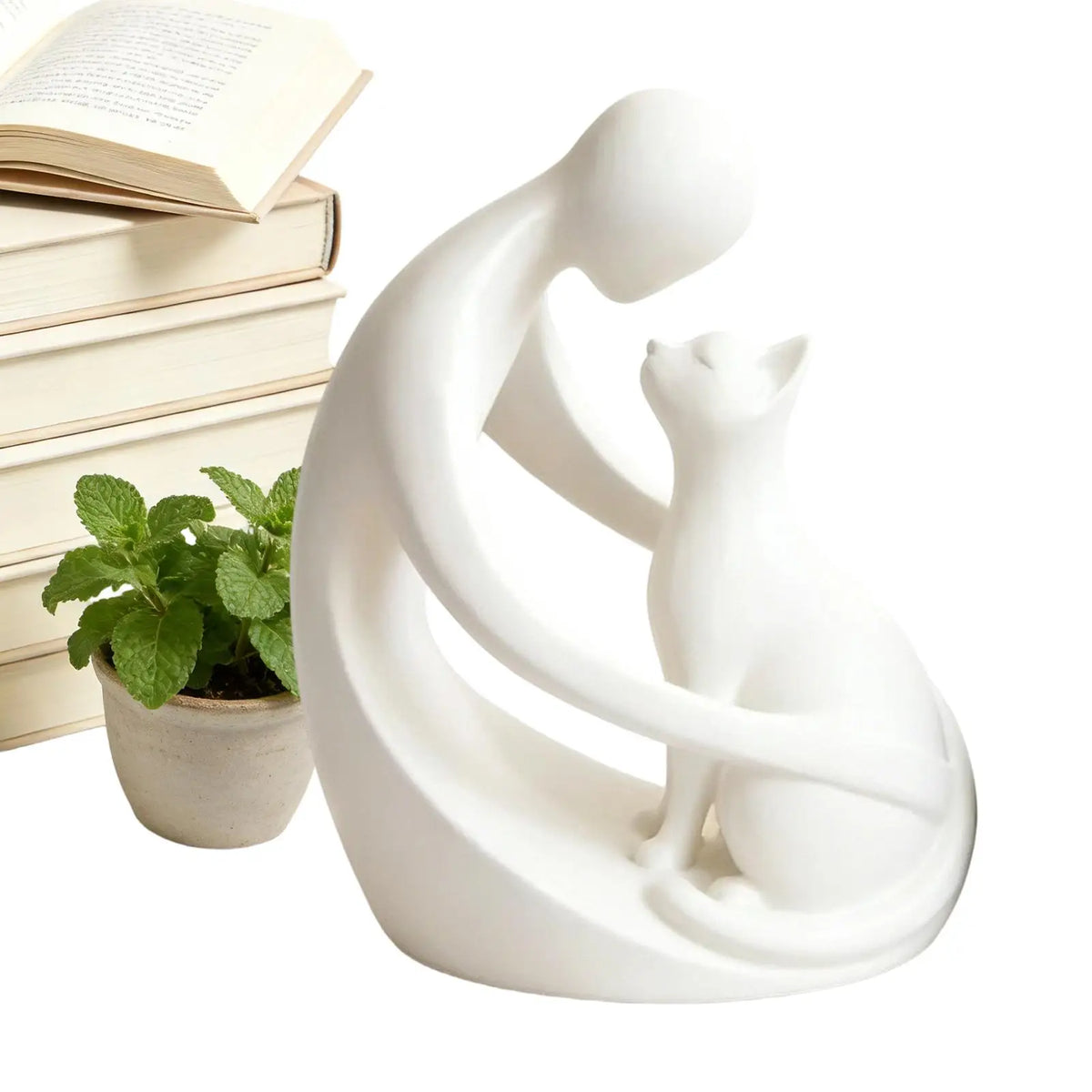statuette moderne personne chat blanc noir stylisée abstraiteDecoration intérieure livre plante verte bougie chandelle